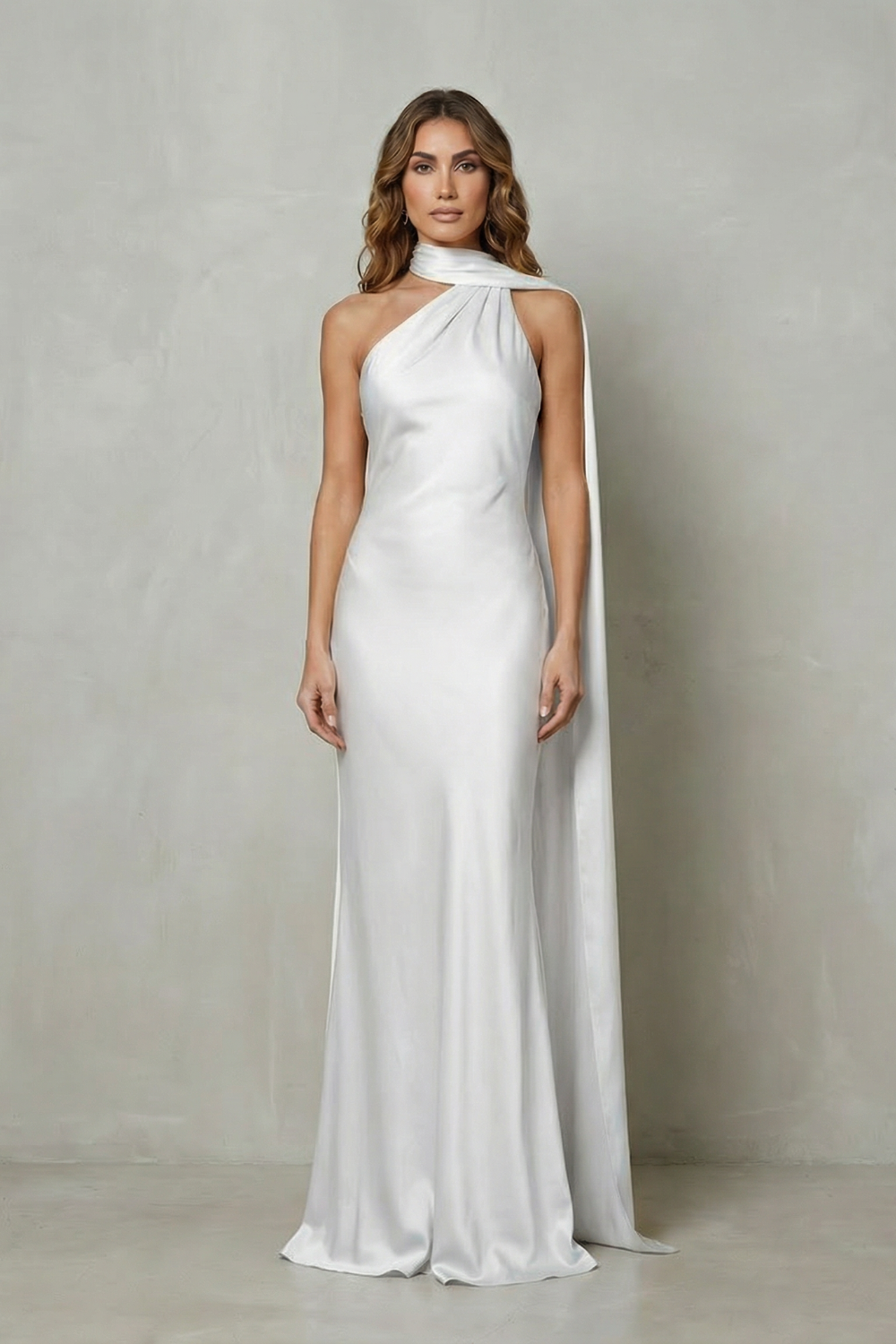 White satin mermaid gown with sleeveless halter neckline and long flowing side drape