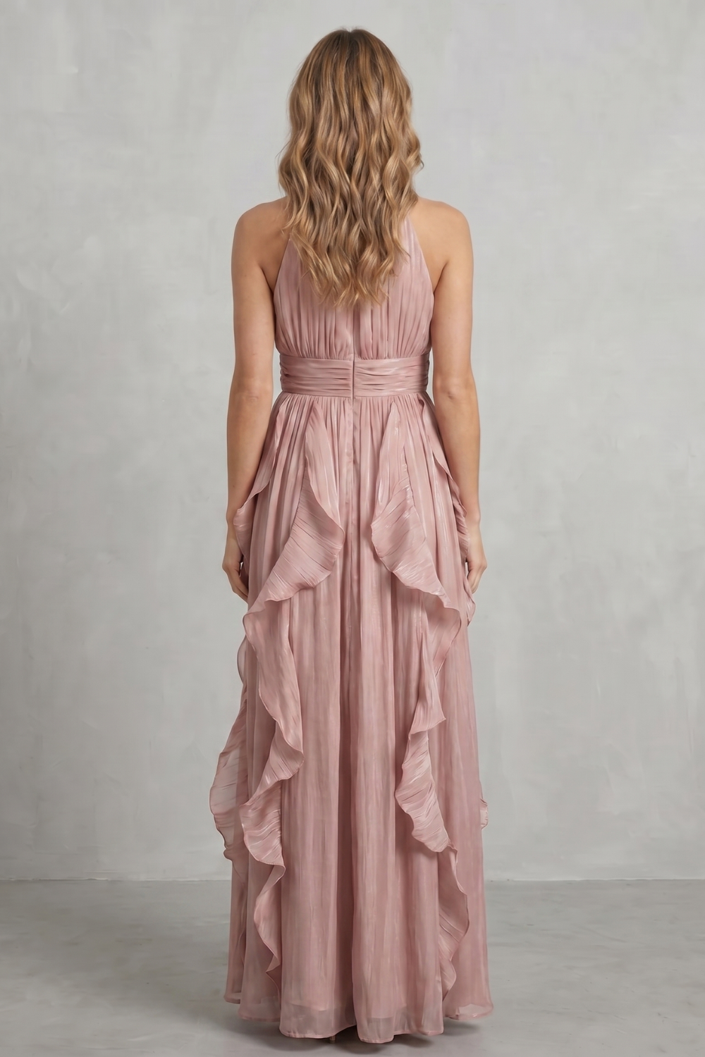 Light pink back view maxi dress with halter neck and layered ruffle skirt