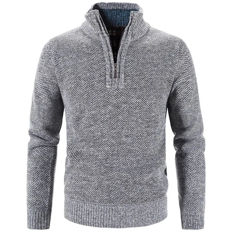 Light gray knit half-zip sweater with front half-zip placket and ribbed cuffs.