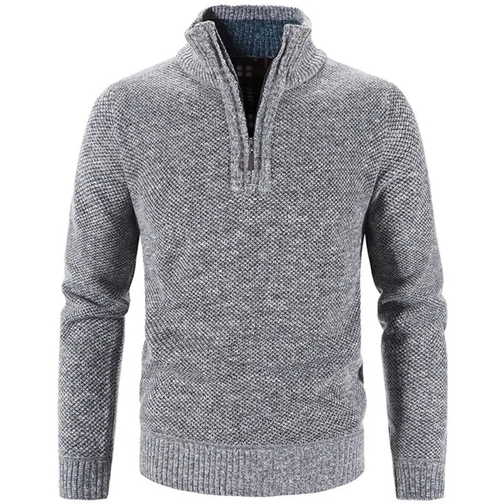 Light gray knit half-zip sweater with front half-zip placket and ribbed cuffs.