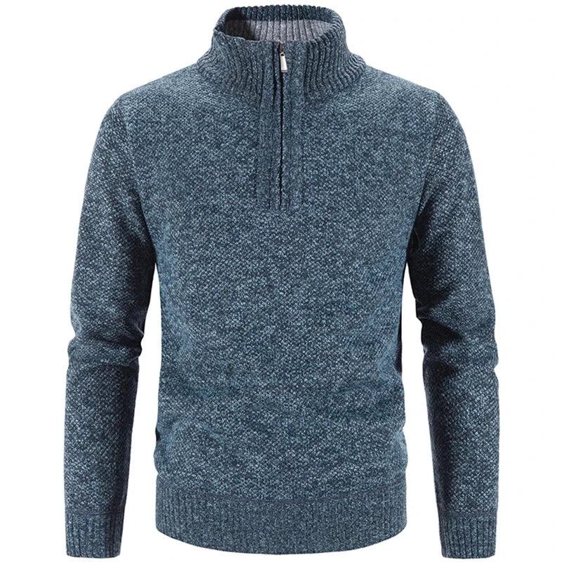 Blue knit half-zip sweater with ribbed stand collar, cuffs, and hem.