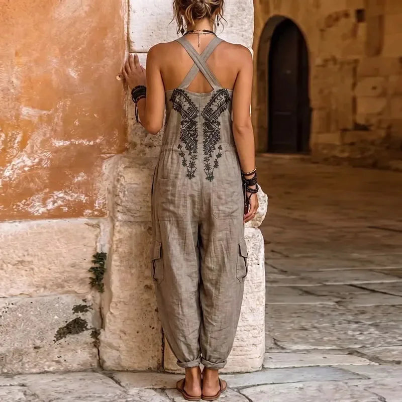 Grey bohemian jumpsuit back with crisscross straps and embroidered center panel