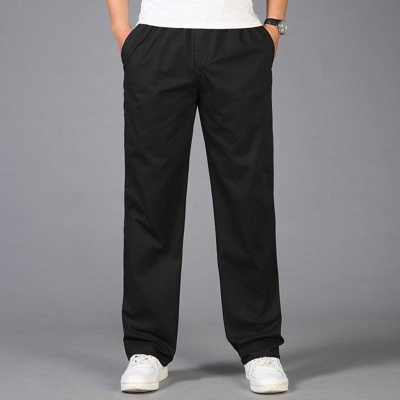 Black linen pants with elastic waist and relaxed tapered legs