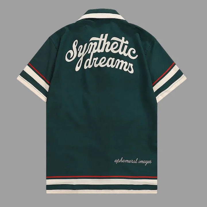 Dark green polo shirt back with bold white text graphic and red-and-cream striped hem