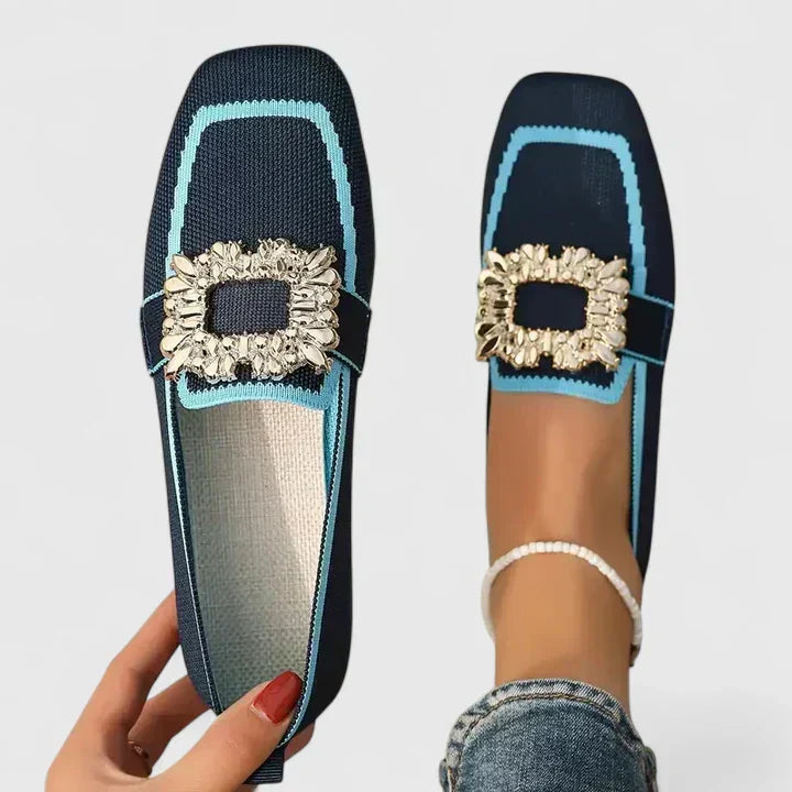 Navy square-toe flats with turquoise trim and gold jewel buckle detail