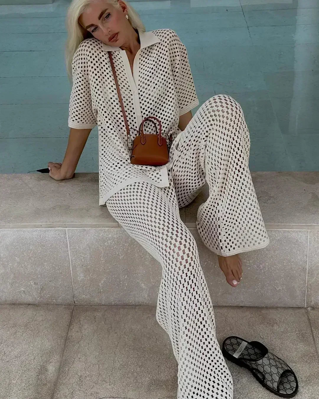 Textured stripe two-piece set in white with open V-neck top and flared wide-leg pants