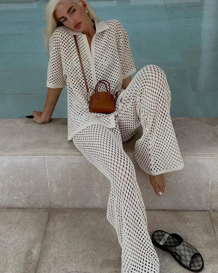 Textured stripe two-piece set in white with open V-neck top and flared wide-leg pants