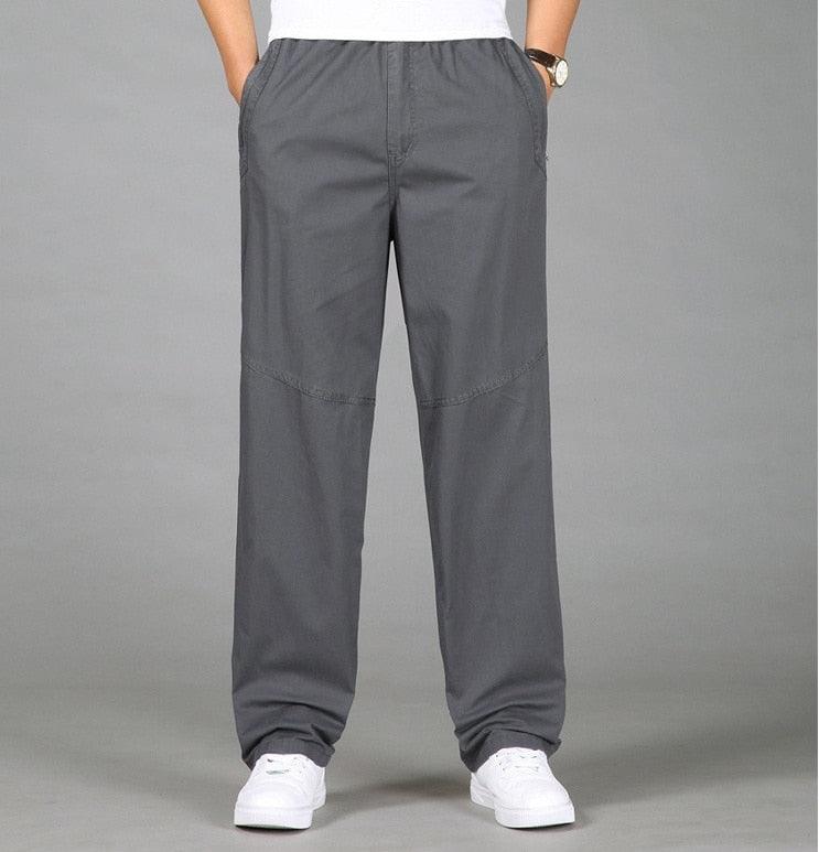 Dark gray linen pants with elastic waist and relaxed tapered legs