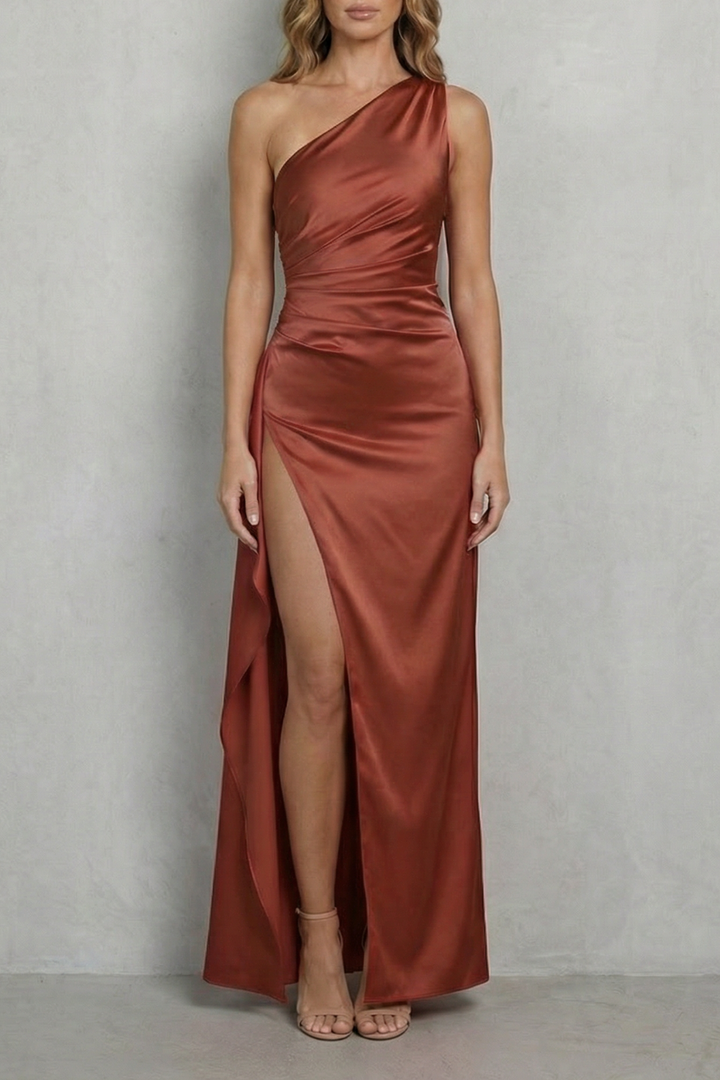 Rust one-shoulder satin gown with draped bodice and thigh-high slit