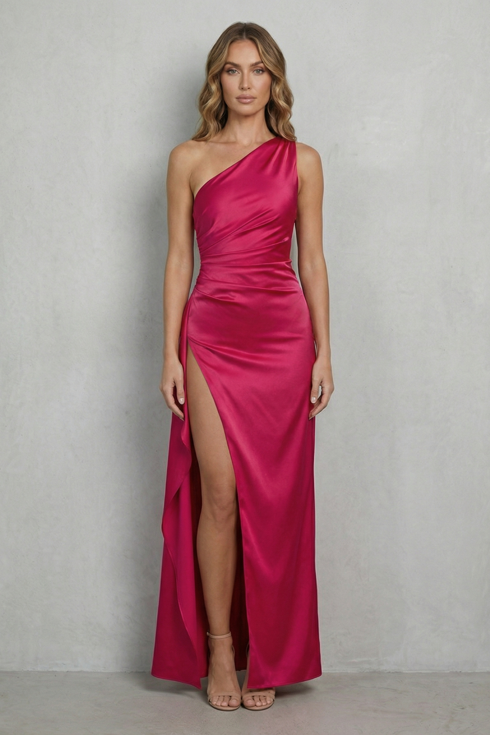 Hot pink one-shoulder satin gown with ruched bodice and thigh-high side slit
