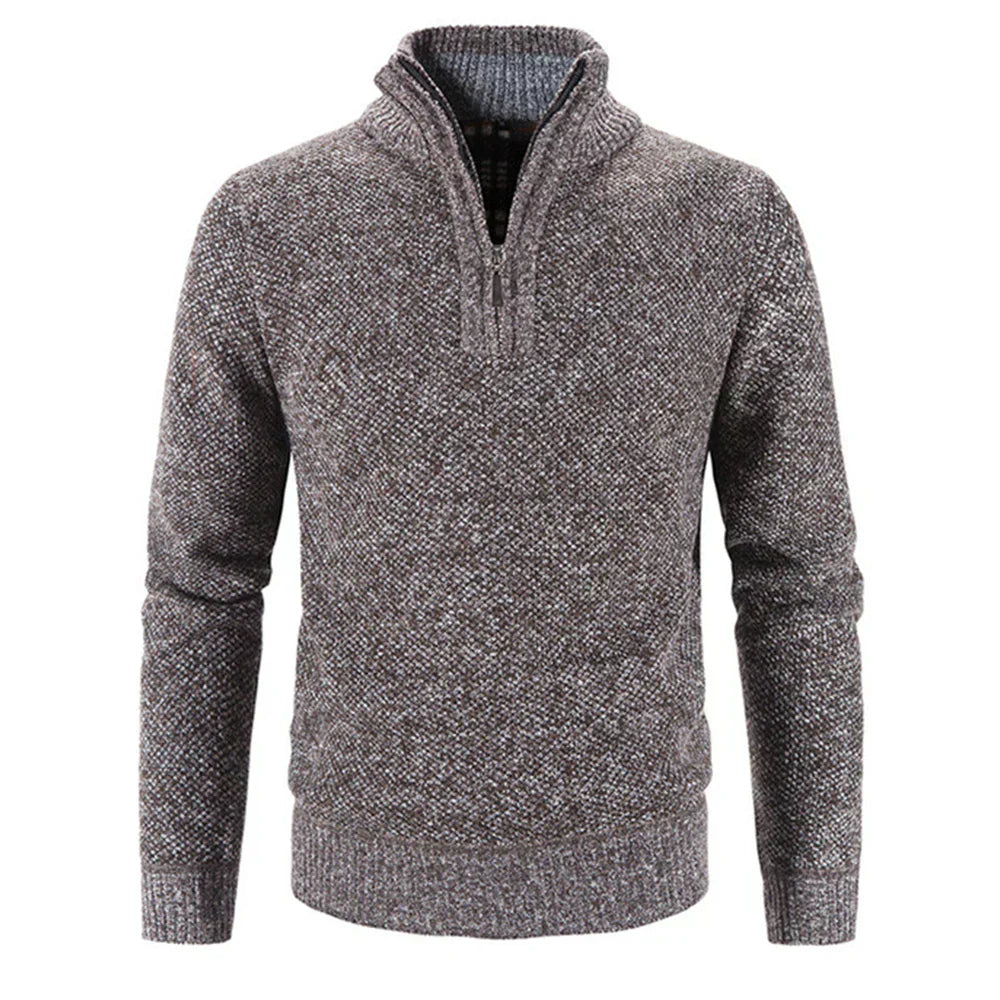 Dark gray knit half-zip sweater with textured yarn and ribbed cuffs.