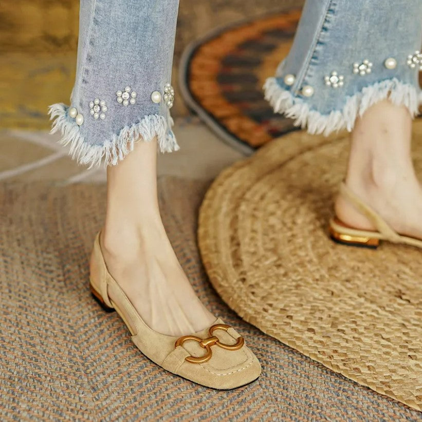 Women’s beige buckle slingback flats with gold-tone hardware and low block heel