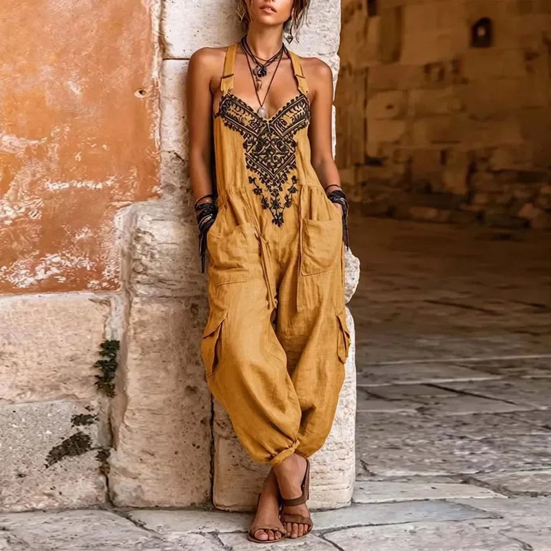 Mustard yellow bohemian jumpsuit with black embroidered V neckline and pockets