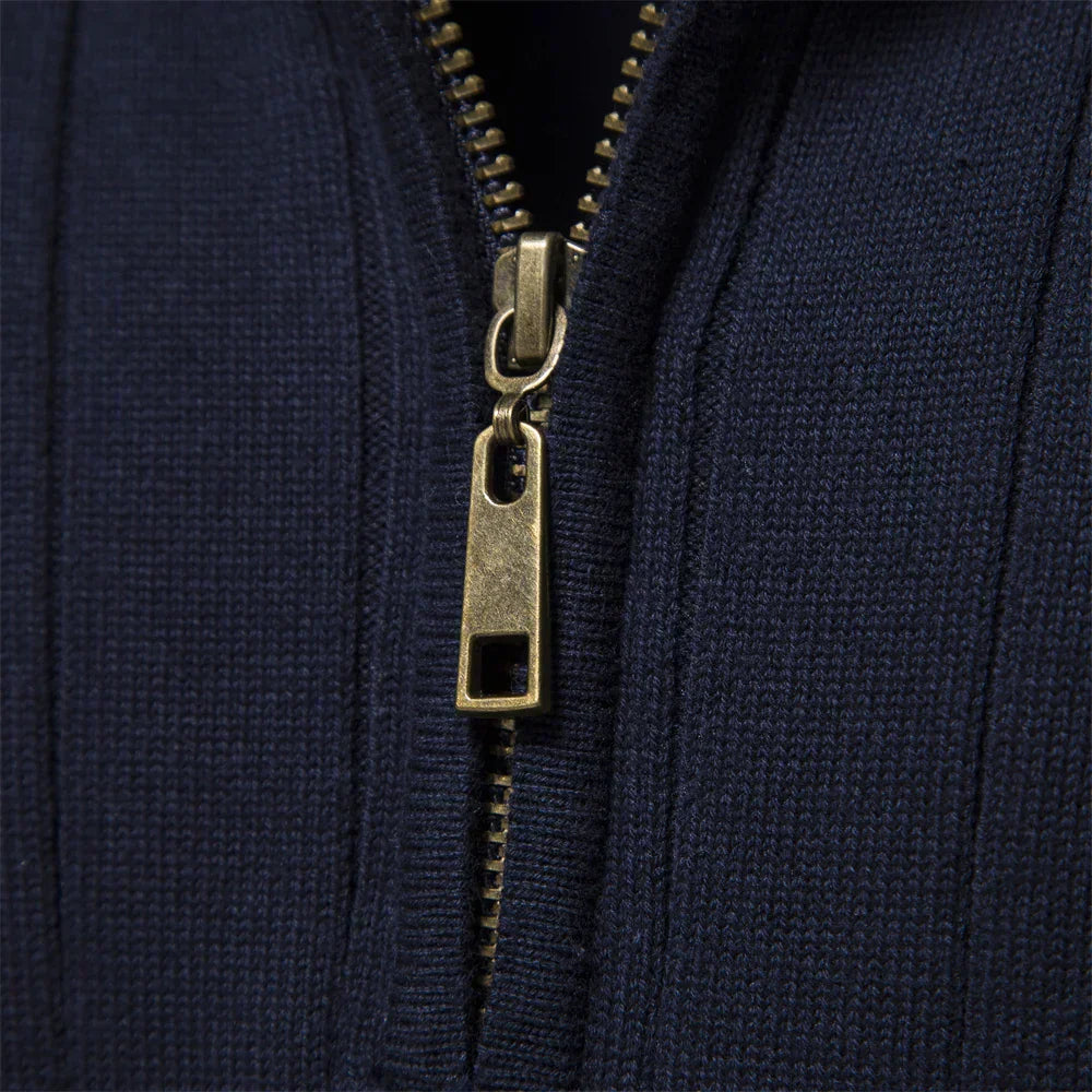 Navy sweater quarter-zip close-up with gold-tone zipper hardware