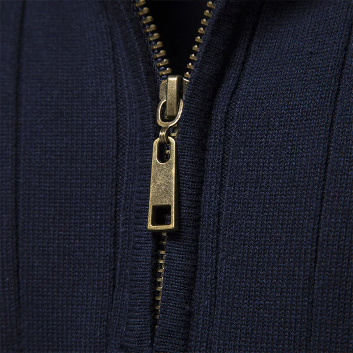 Navy sweater quarter-zip close-up with gold-tone zipper hardware