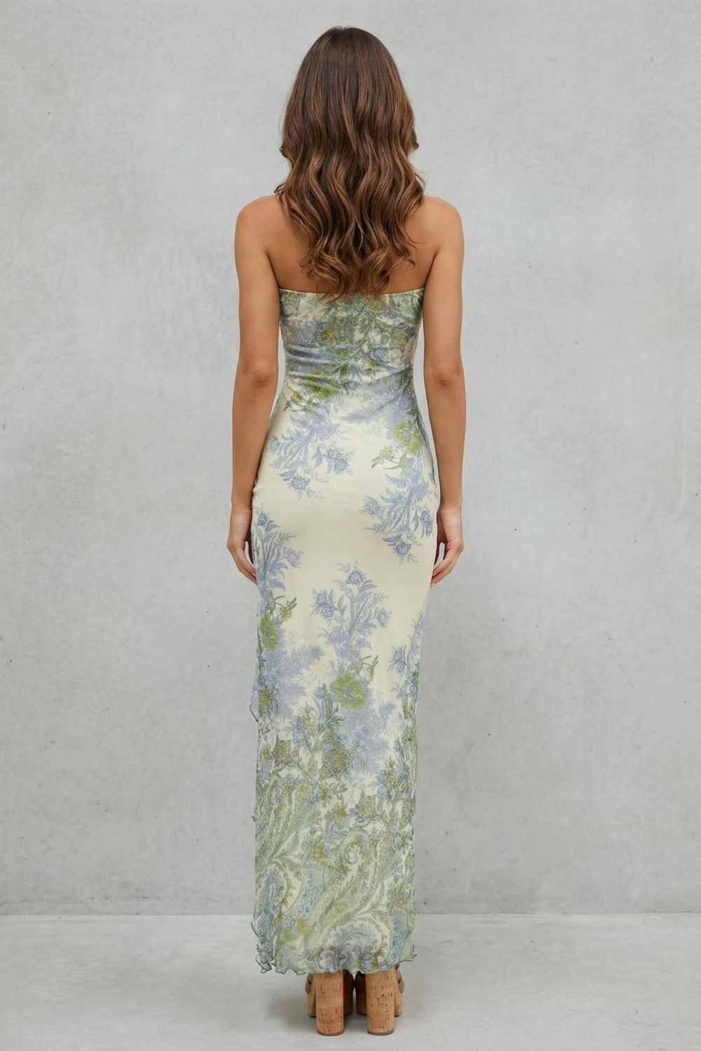 Women's strapless maxi dress, back view in cream floral print with ruffled hem