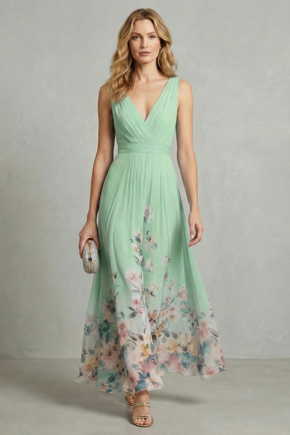 Light green V-neck pleated maxi dress with floral hem and sleeveless fit