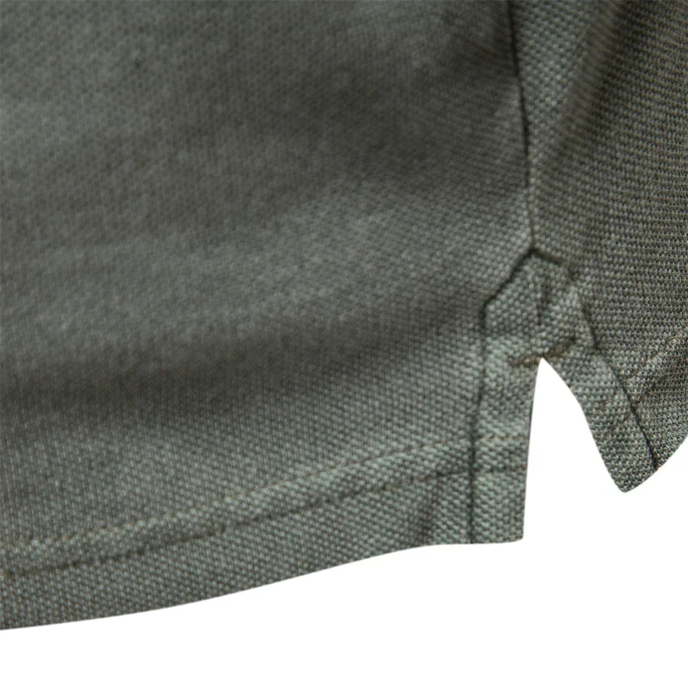 Men's polo shirt close-up of textured fabric and button placket seam
