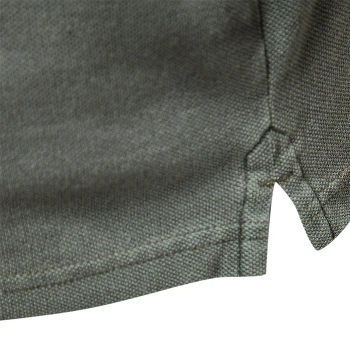 Men's polo shirt close-up of textured fabric and button placket seam