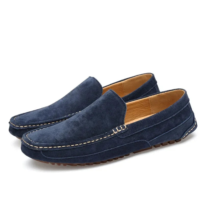 Navy suede slip-on loafer with stitched seam detail and rubber sole tread