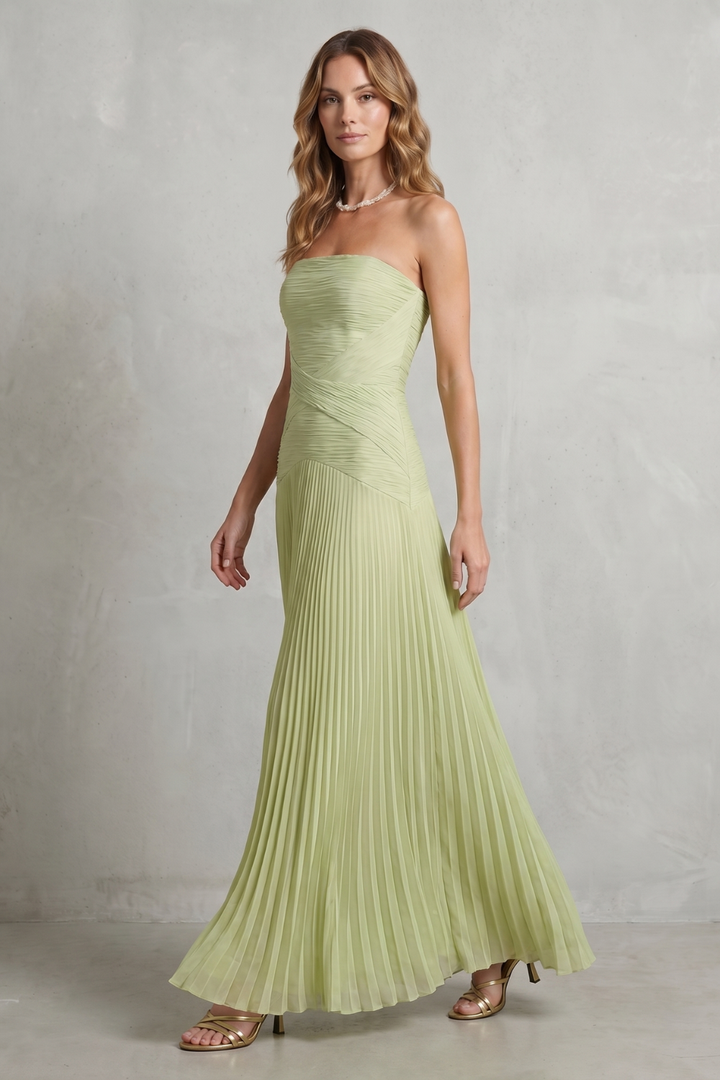 Sage green strapless pleated maxi dress, side view with pleated skirt