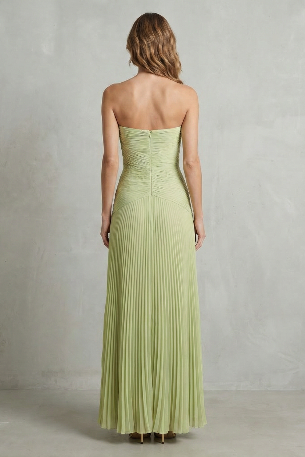 Sage green strapless pleated maxi dress, back view with exposed upper back