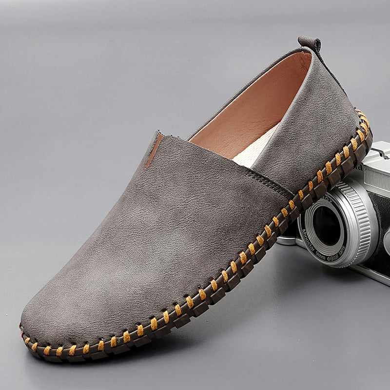 Ash-gray stitch loafer with contrast welt and moc-style stitching along sole