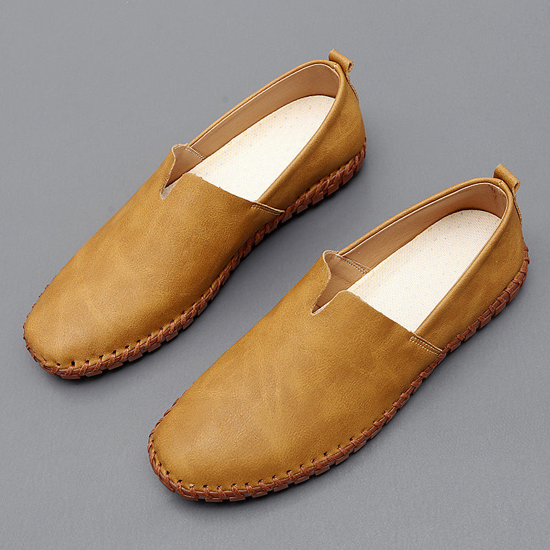 Pair of tan stitch loafers with contrast moc stitching on the toe