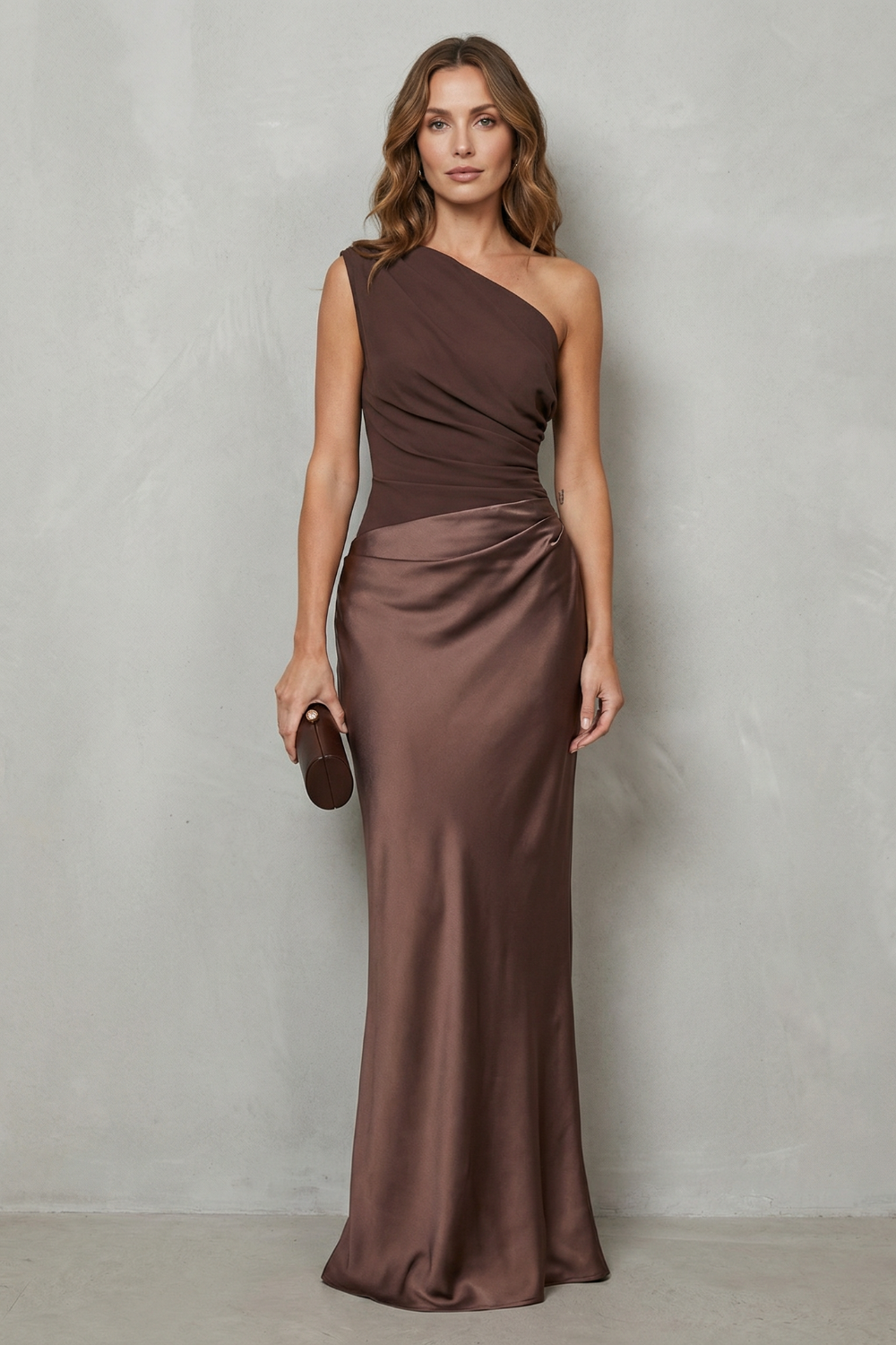 Brown one-shoulder satin evening gown with diagonal drape and gathered waist