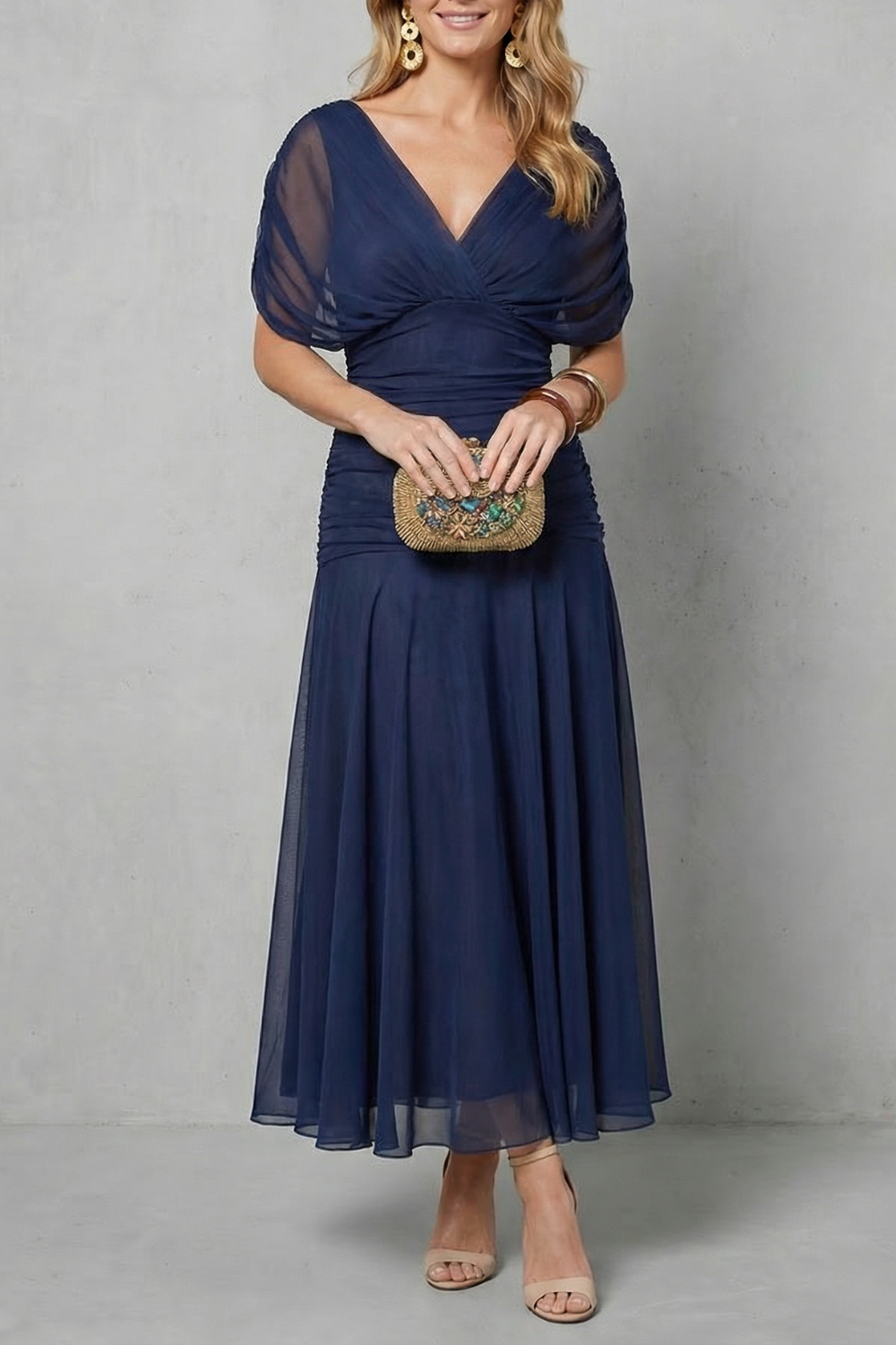 Navy off-shoulder maxi dress with V-neck wrap bodice and tiered chiffon skirt