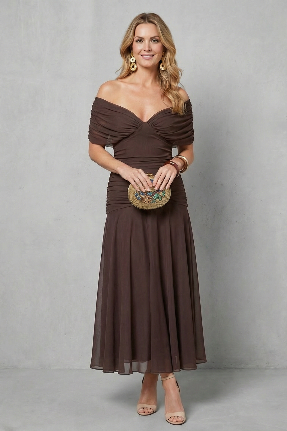 Dark brown off-shoulder maxi dress with gathered sleeves and flowy tiered skirt