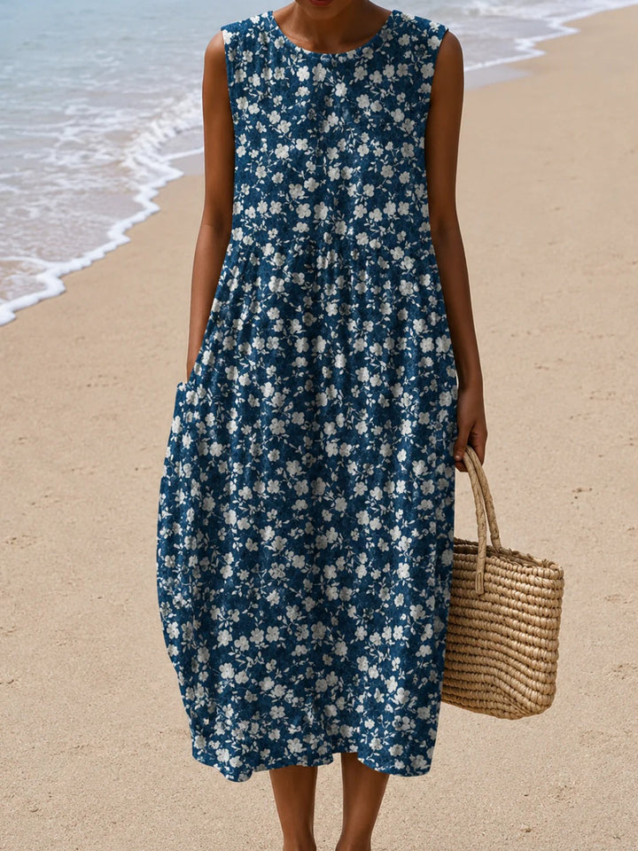 Sleeveless floral maxi dress, navy blue with white flower sprig pattern.
