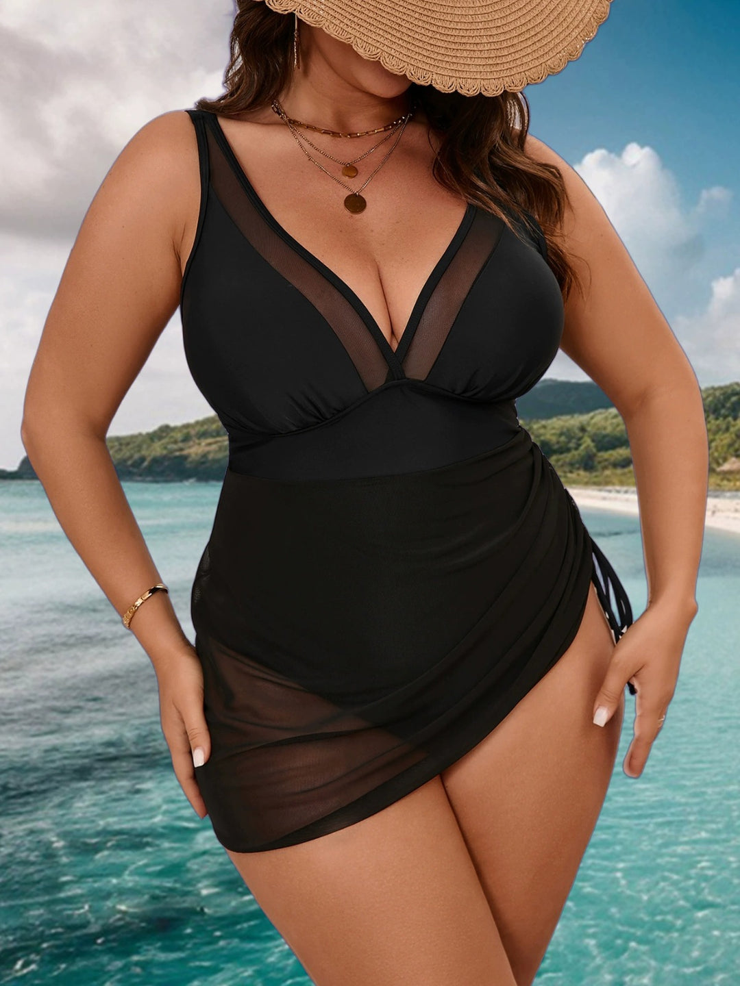 Black plus size mesh swim dress with V-neck bodice and ruched skirt