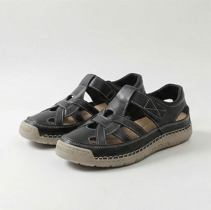 Black cross-strap comfort flat sandals with double straps and cushioned tread