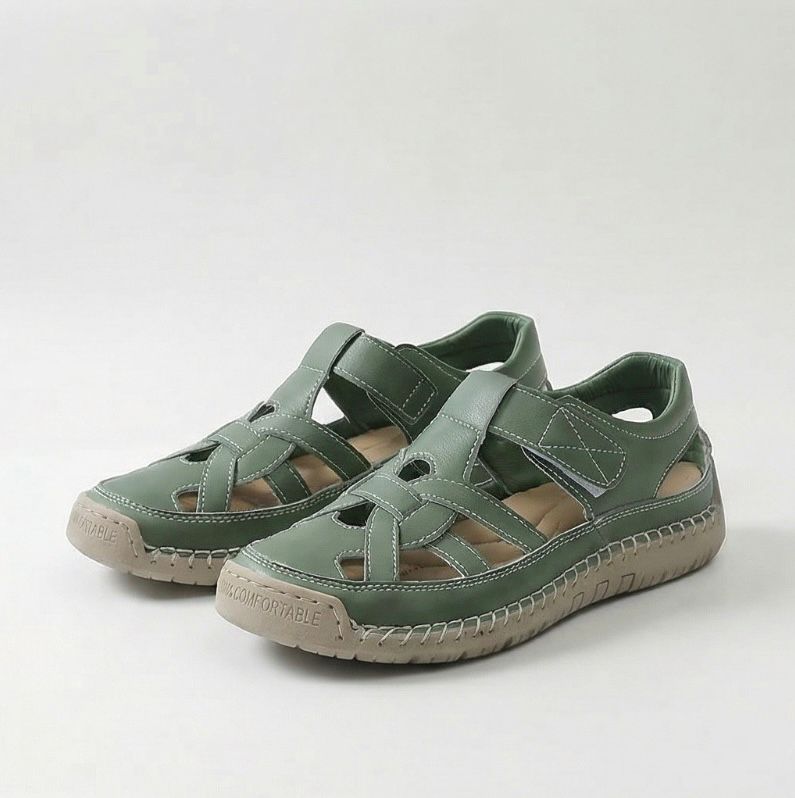 Green cross-strap comfort flat sandals with cutout upper and textured sole