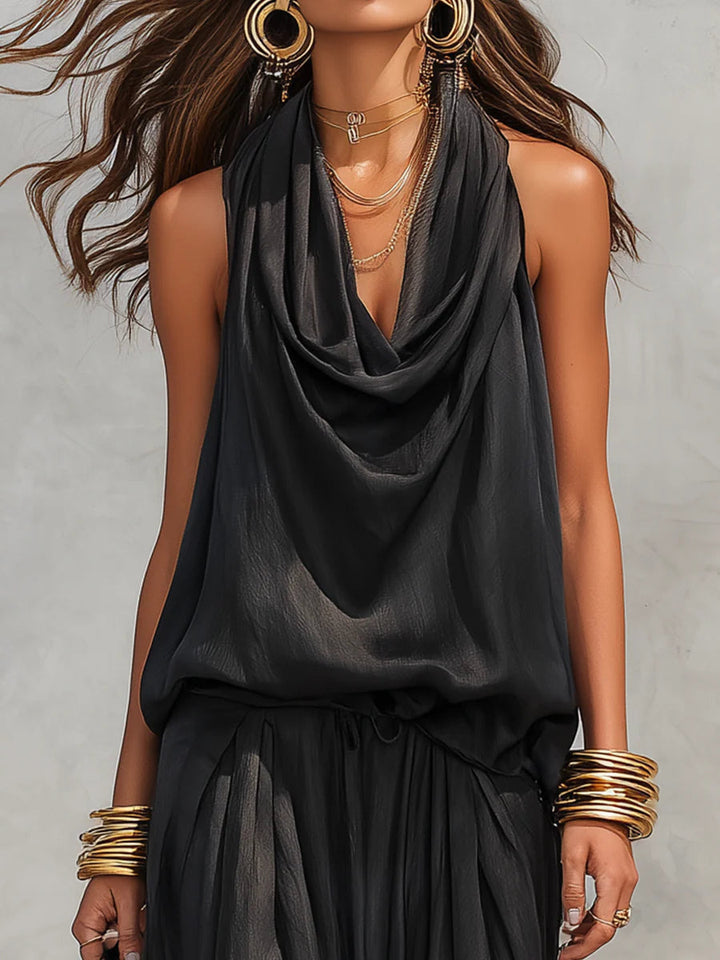 Black halter cowl-neck top with layered pleats and gathered waist, set detail