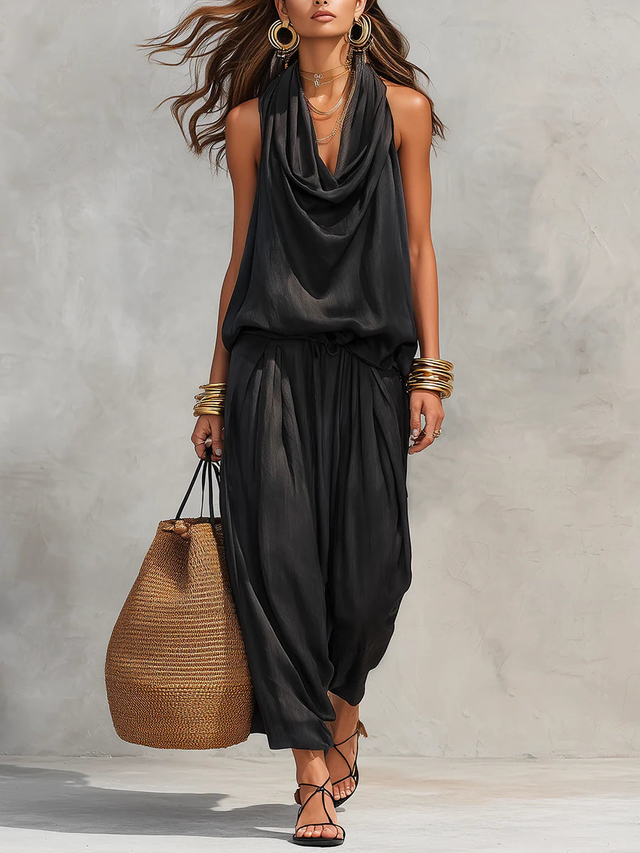 Black halter pleated sleeveless set with draped cowl neckline and wide-leg pants
