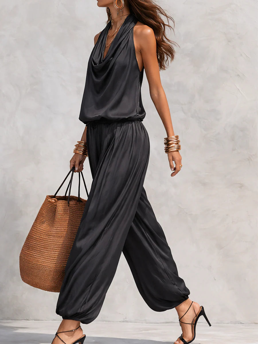 Black halter pleated set with draped neckline and loose wide-leg pants, side view
