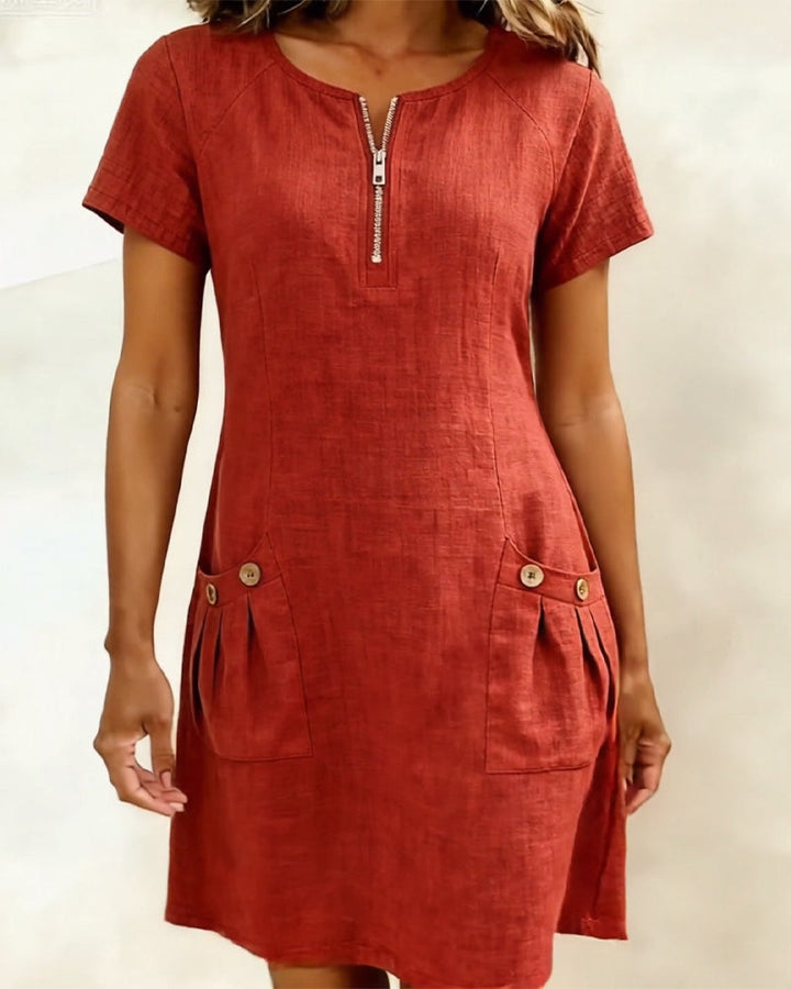 Rust red casual zip-front dress with short sleeves and two front pockets