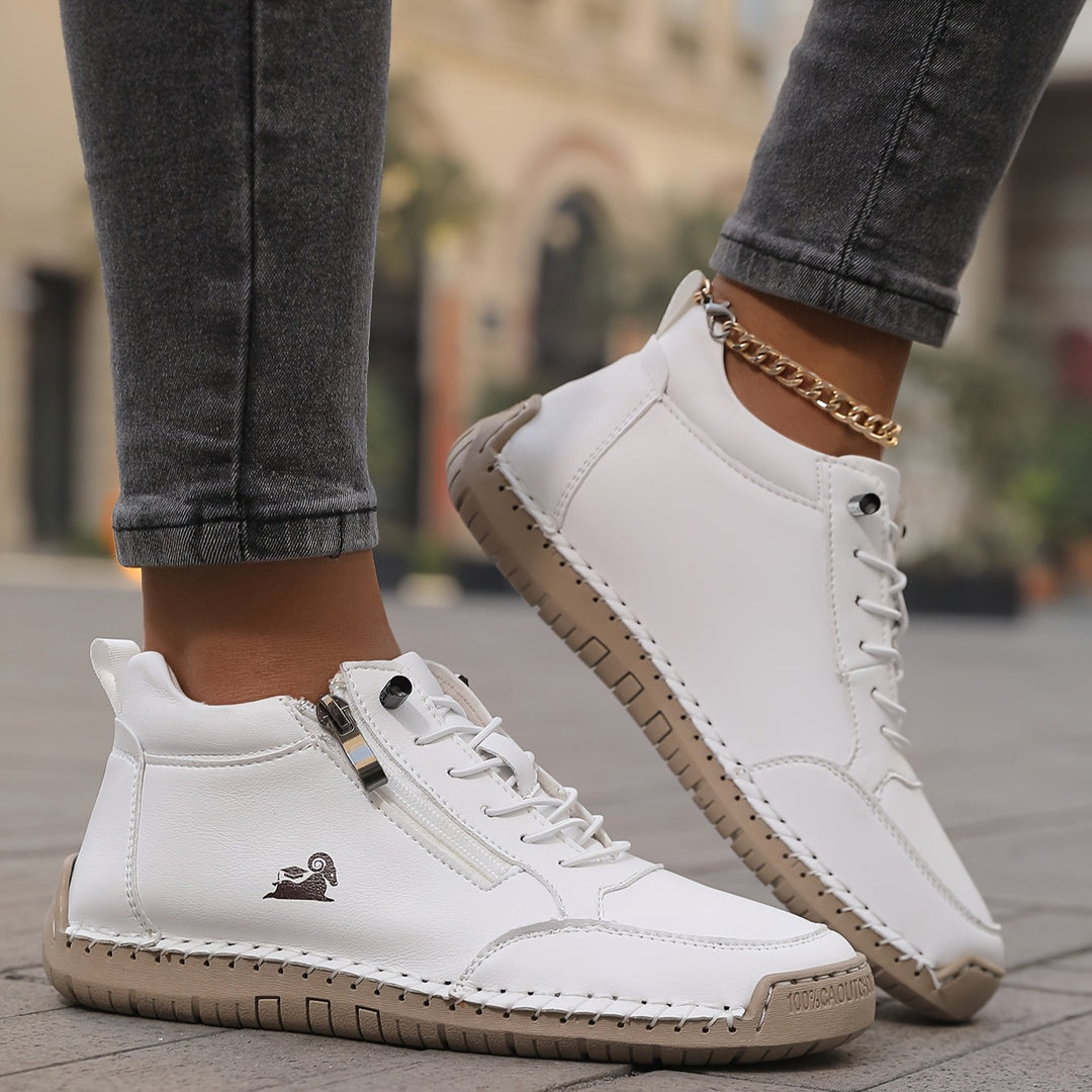 White side-zip lace-up sneakers with thick tan sole and small logo on side