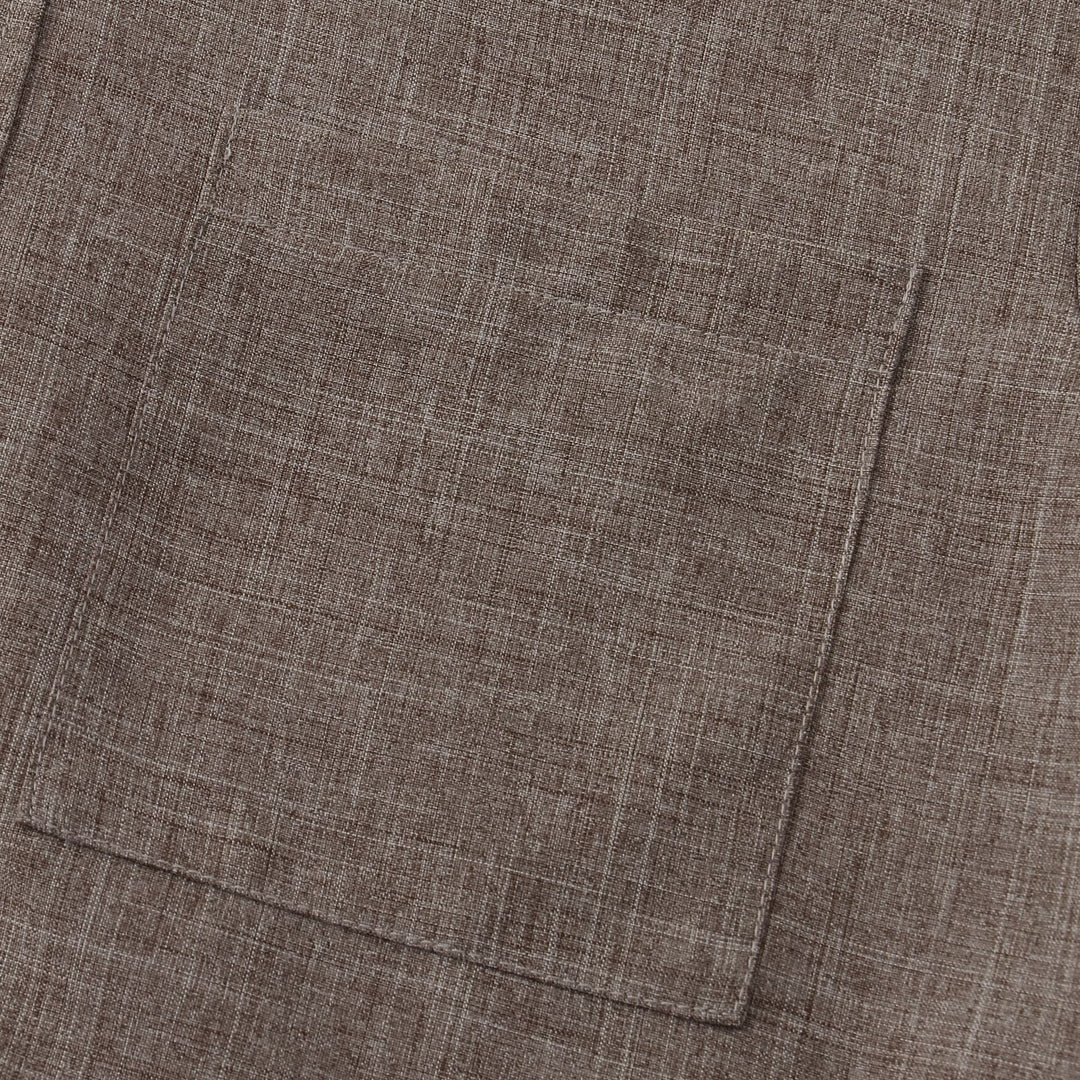 Taupe cotton shirt hem with stitched seam and bottom edge detail.