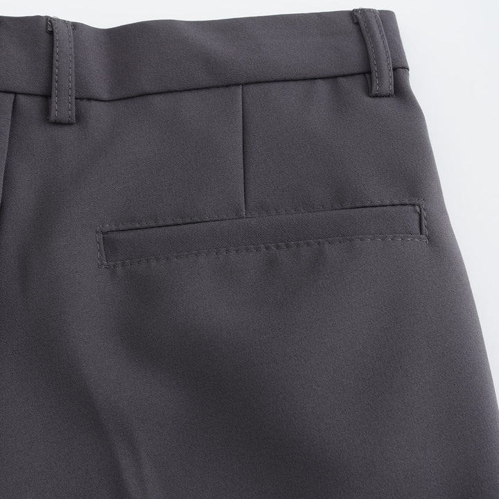 Gray stretch pants with welt pocket detail and stitched waistband edge