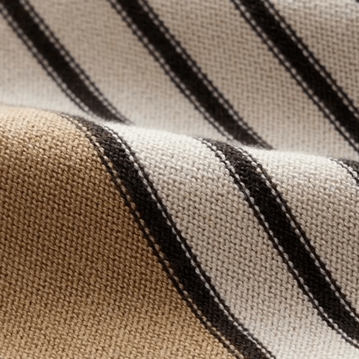 Beige knit fabric close-up with vertical black stripes and tan stripe bands