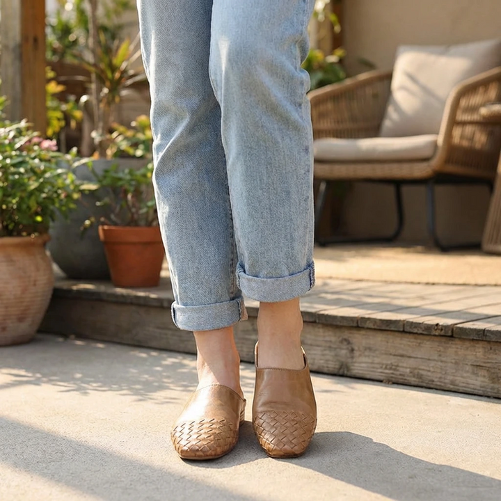 Women’s woven flat mules, tan flat slip-ons worn with cuffed jeans
