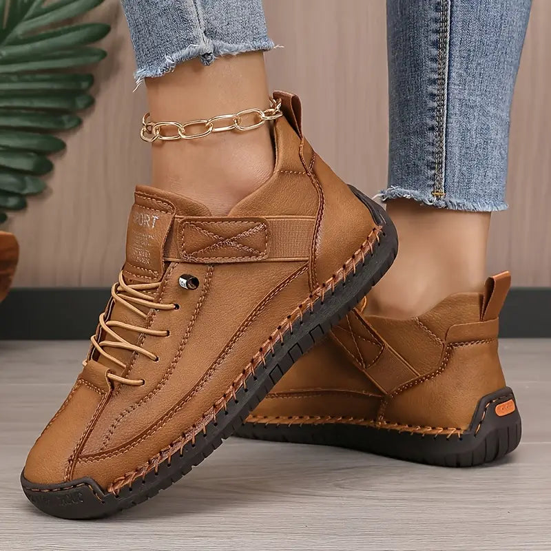 Brown orthopedic slip-on sneaker with lace-up front and cushioned rubber outsole