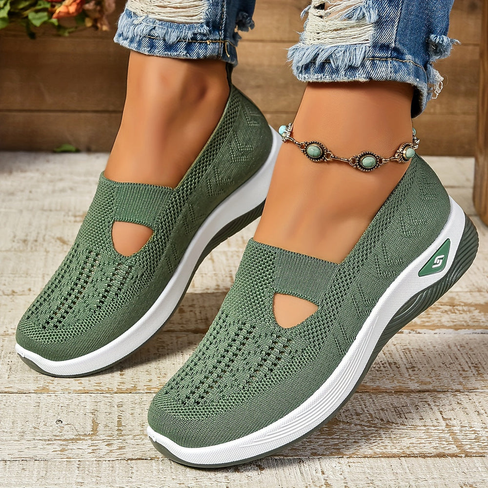 Green knit slip-on sneakers with white sole and side cutout panels