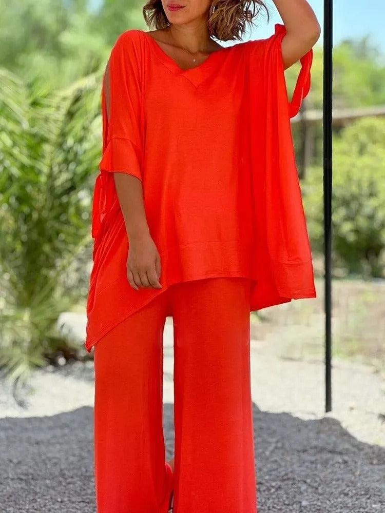 Flowing two-piece set, red V-neck tunic with draped hem and wide-leg pants