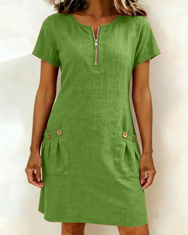 Green casual zip-front dress with short sleeves and two front button pockets