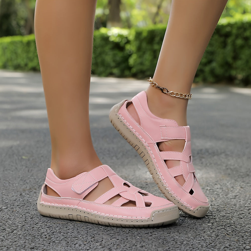 Pink cross-strap comfort flat sandals on light beige tread sole
