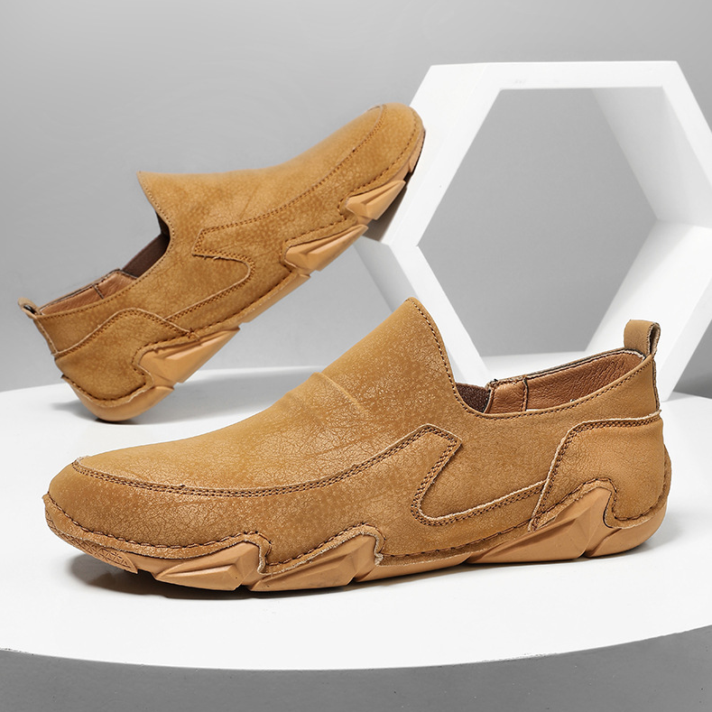 Brown slip-on loafers with stitched moc-toe and chunky rubber sole.